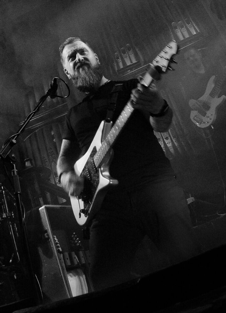 Philip Joyce is playing the guitar