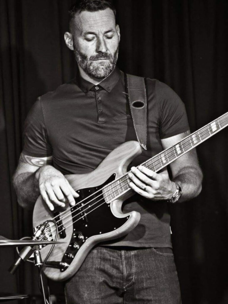 Jay Clarke is playing the guitar